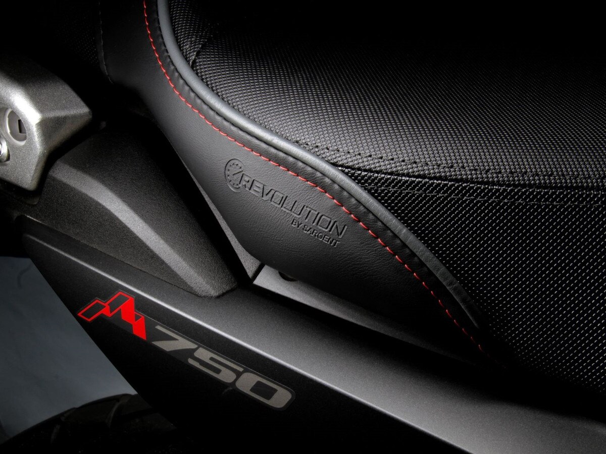 Embossed REVolution logo is an elegant touch on Sargent's REVolution and DIY kits for the Honda Transalp available on the special Performance Plus version with Gray Welt and Red Stitch.